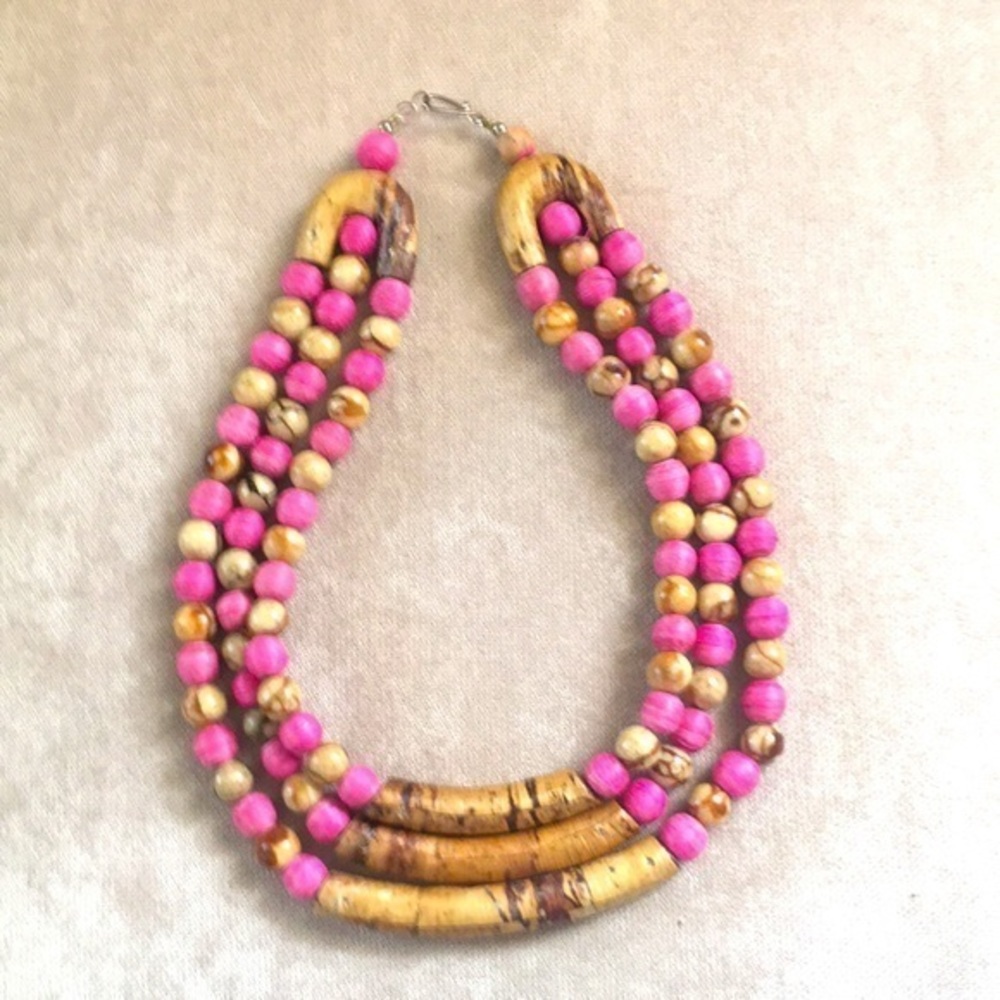 Pink and natural wood beaded necklace.